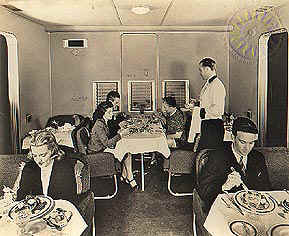 This is a photo of the dining room on a Boeing 314 Flying Boat.  This was how they served dinner on transatlantic flights.